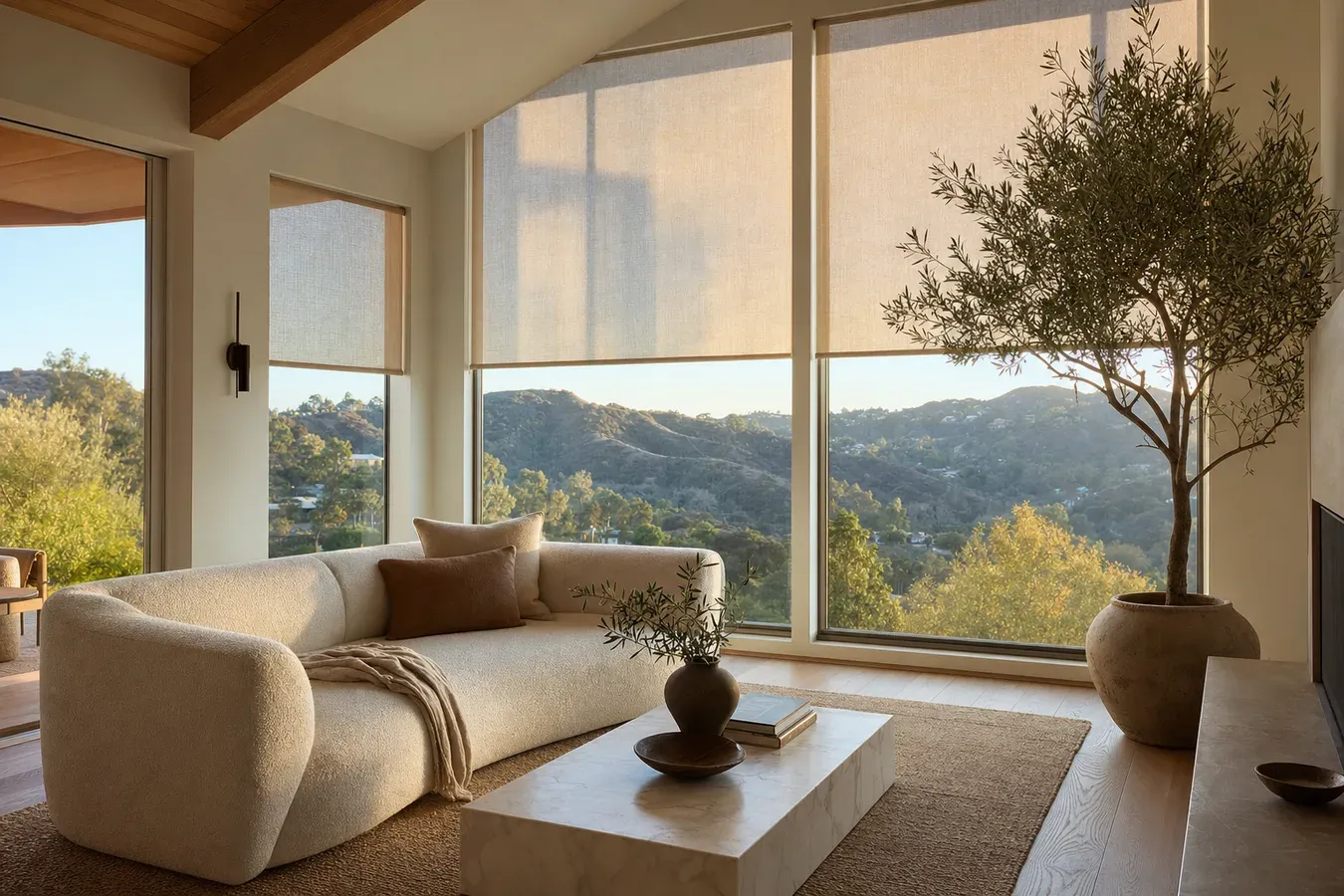 Custom light-filtering roller shades in a Calabasas home with canyon view